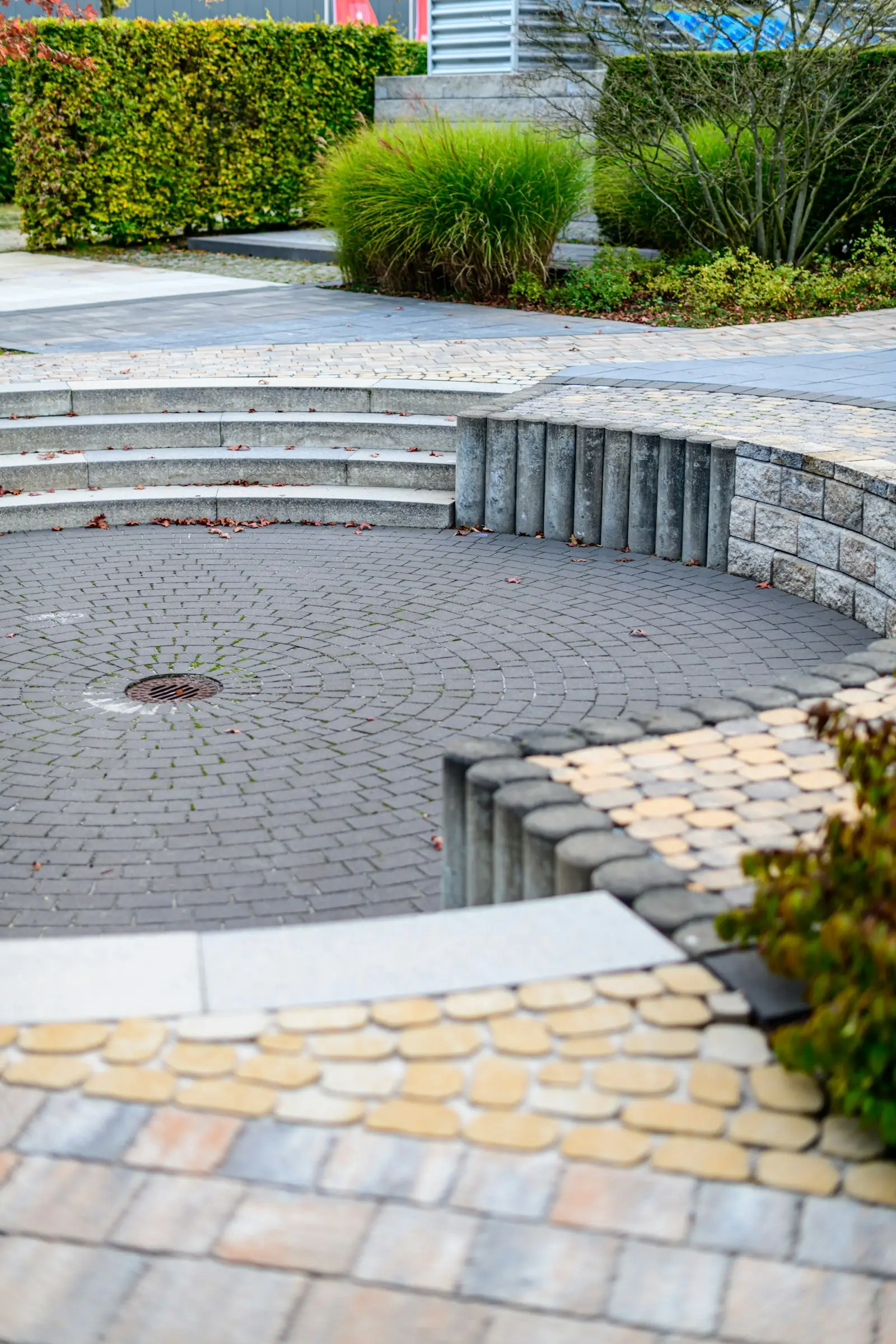 Paver patio with stone steps and plantings